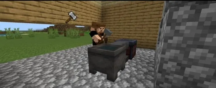 Кузнец в кузнице