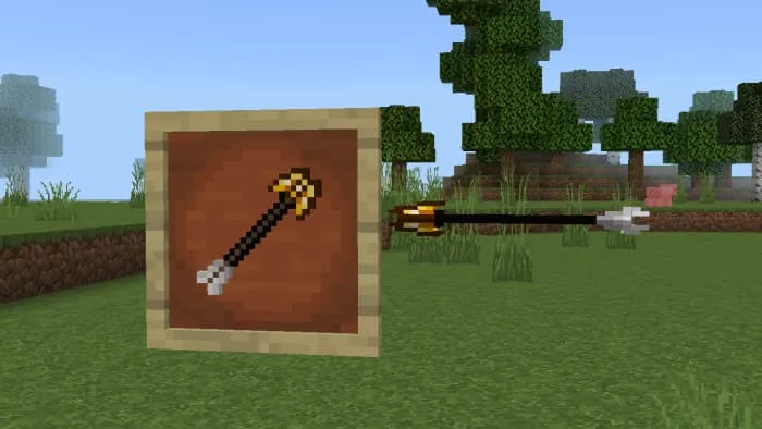 Позолоченная стрела в рамке