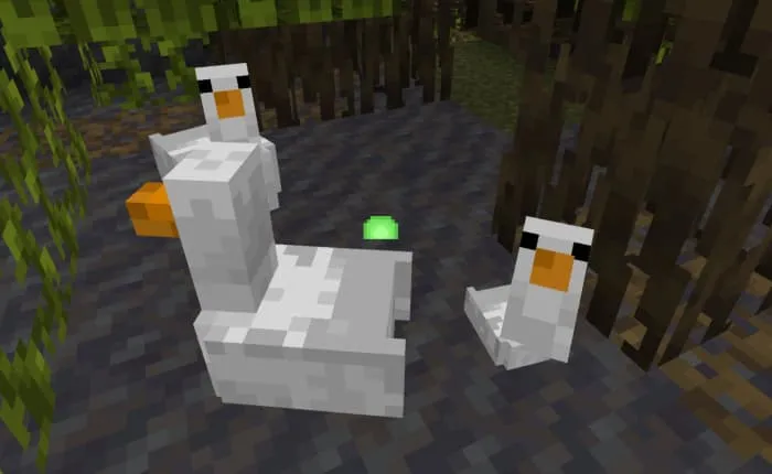 Взрослые и маленький гуси