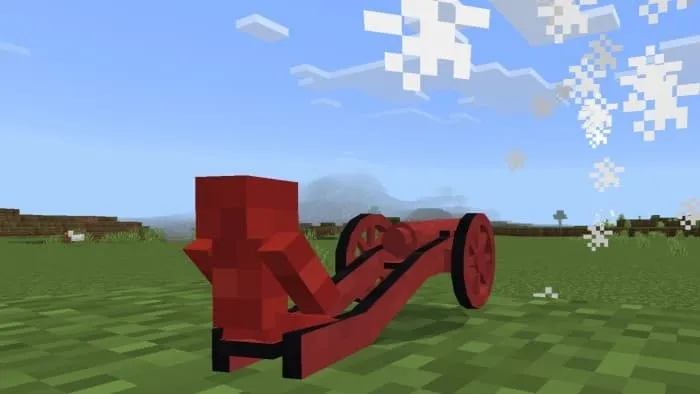 Красный солдатик стреляет из игрушечной пушки