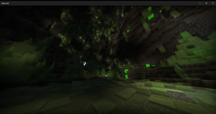 Слизкая пещера с влажными стенами и зелёным свечением">