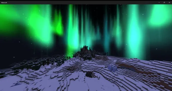 Изумрудное северное сияние с завихрениями над деревьями