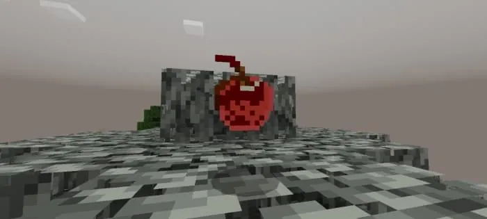 Шоколадное яблоко лежит на листве