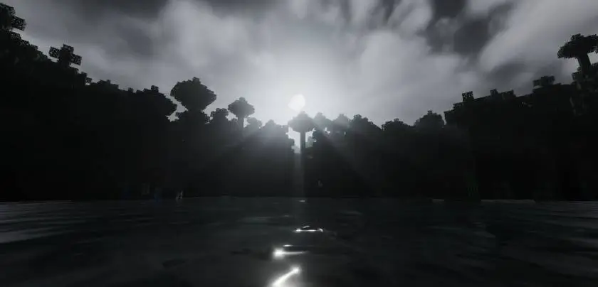 Темный закат над лесом и озером