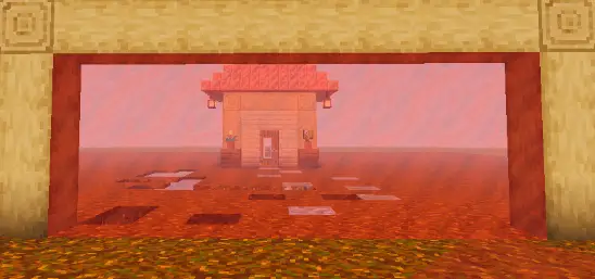 Маленький дом виден через красное стекло