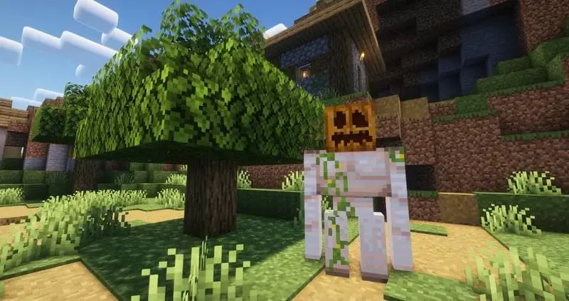 Железный голем с тыквой на голове на фоне деревни