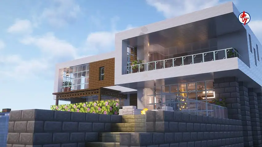 Вид на светлый двухэтажный дом с каменной лестницей