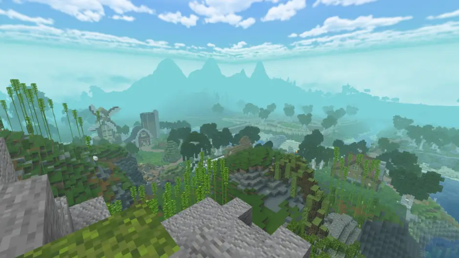 Несколько построек рядом с лесом и рекой