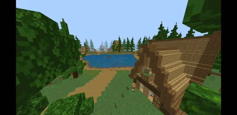 Деревянные дома вокруг озера в еловом лесу