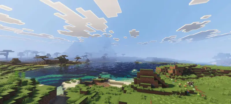 Ярко-синее озеро рядом с холмом и долиной