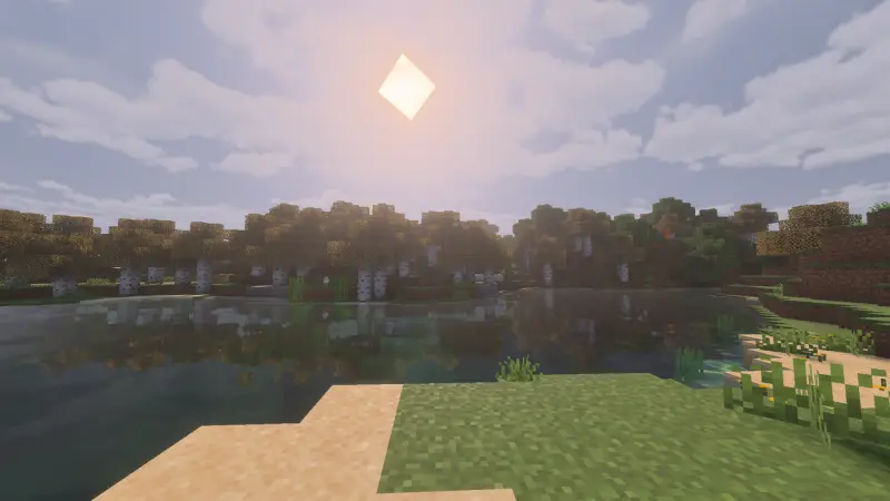 Яркое солнце над лесом и озером