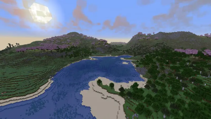 Широкая река протекает между двух гор рядом с лесом