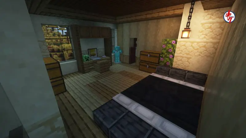 Большая спальня в черной кроватью и сундуками