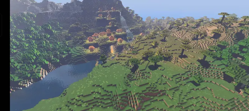 Солнечный день над несколькими биомами и деревней